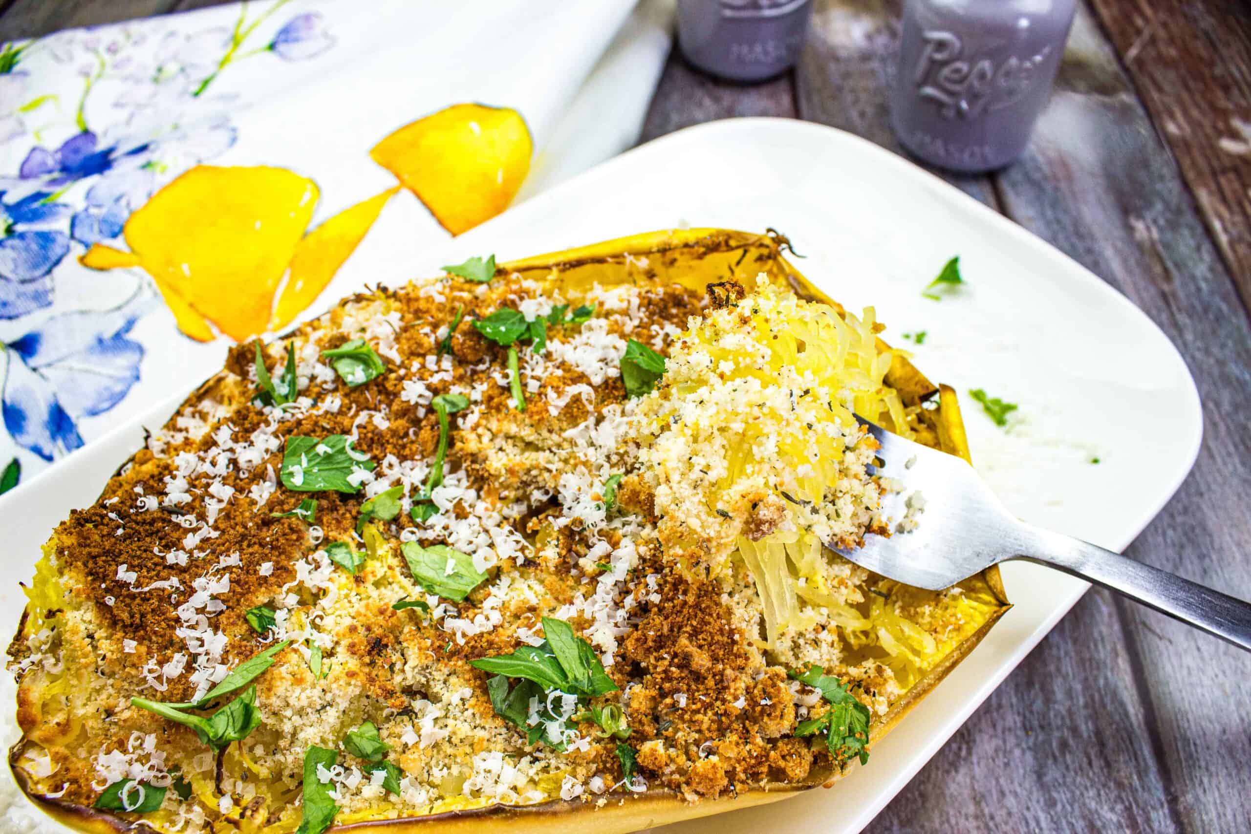 Smoked spaghetti squash on a white plate.