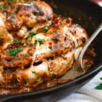 Stuffed chicken marsala in a cast iron skillet.