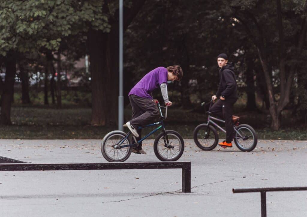 Teenage boys on bikes.