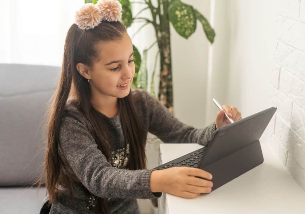 Teenage girl learning online.