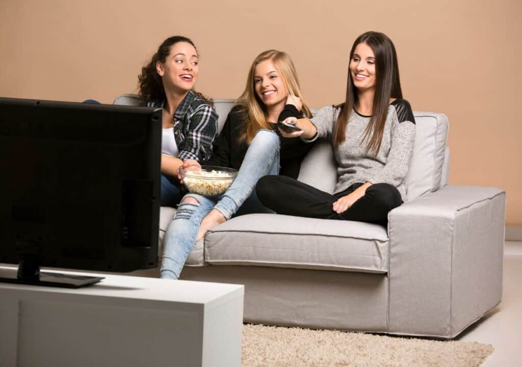 Teenage girls watching movies.