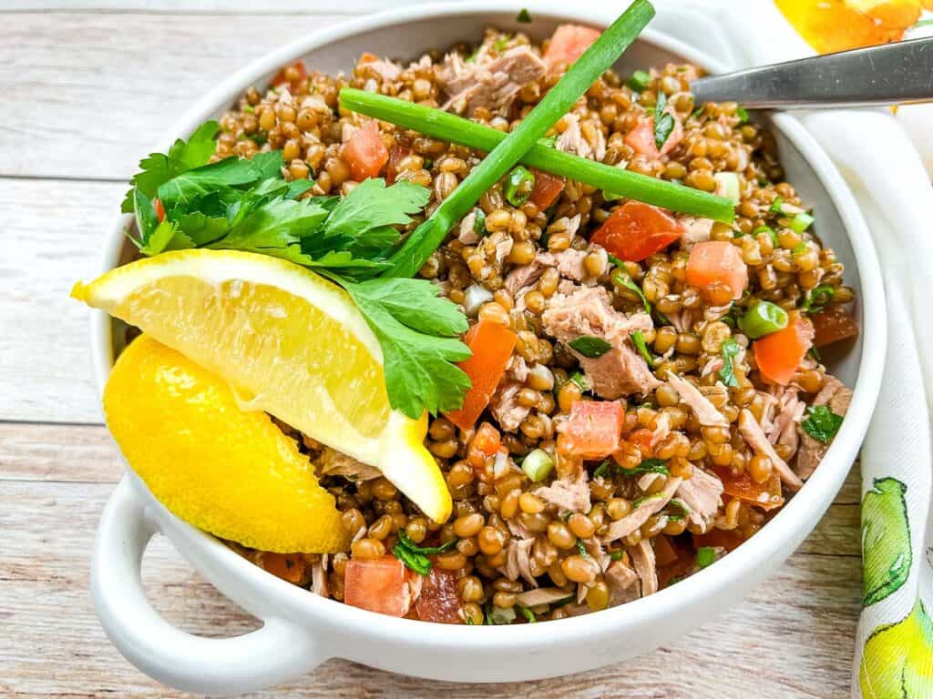 Wheat Berry Salad with Tomato & Tuna in a bowl.