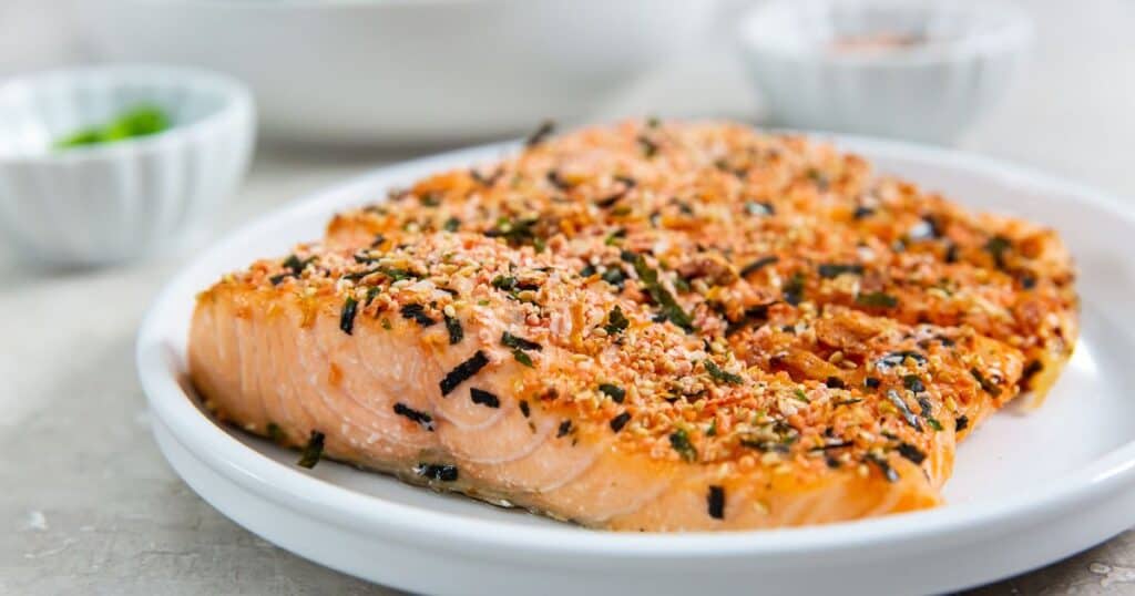 furikake salmon on a white plate.