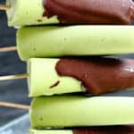 Avocado Popsicles laered on top of each other.