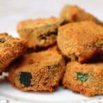 Crispy Baked Zucchini served on a white plate.