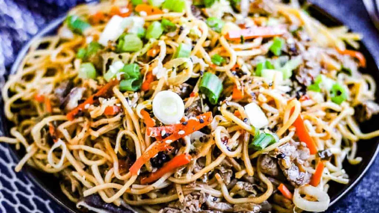 Beef yakisoba noodles with veggies and pickled ginger.