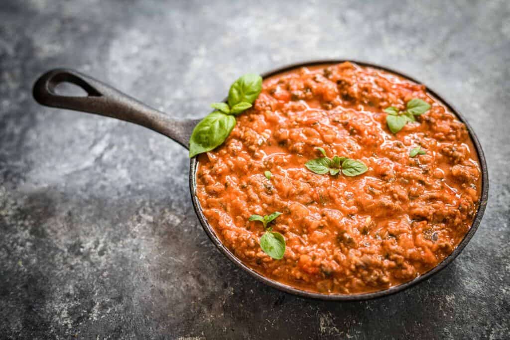 Bolognese sauce in a small cast iron. 