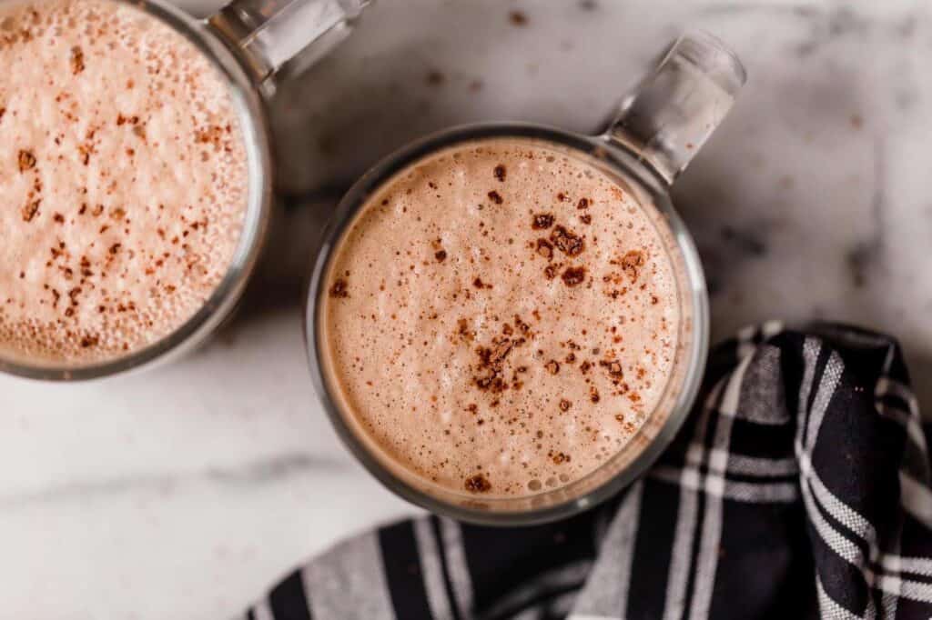 Two glass mugs of bulletproof peppermint mocha.