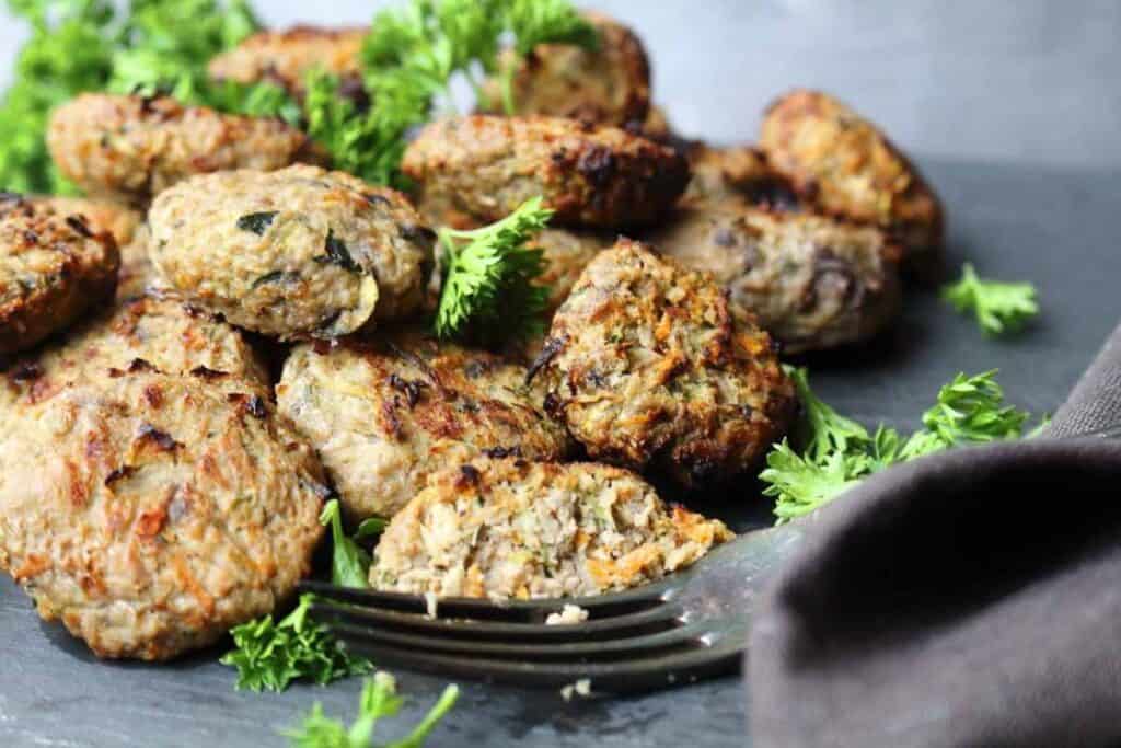 Mini burgers with parsley. 