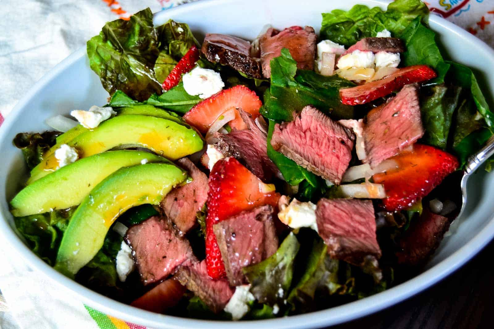 California steak salad with strawberries and avocados.