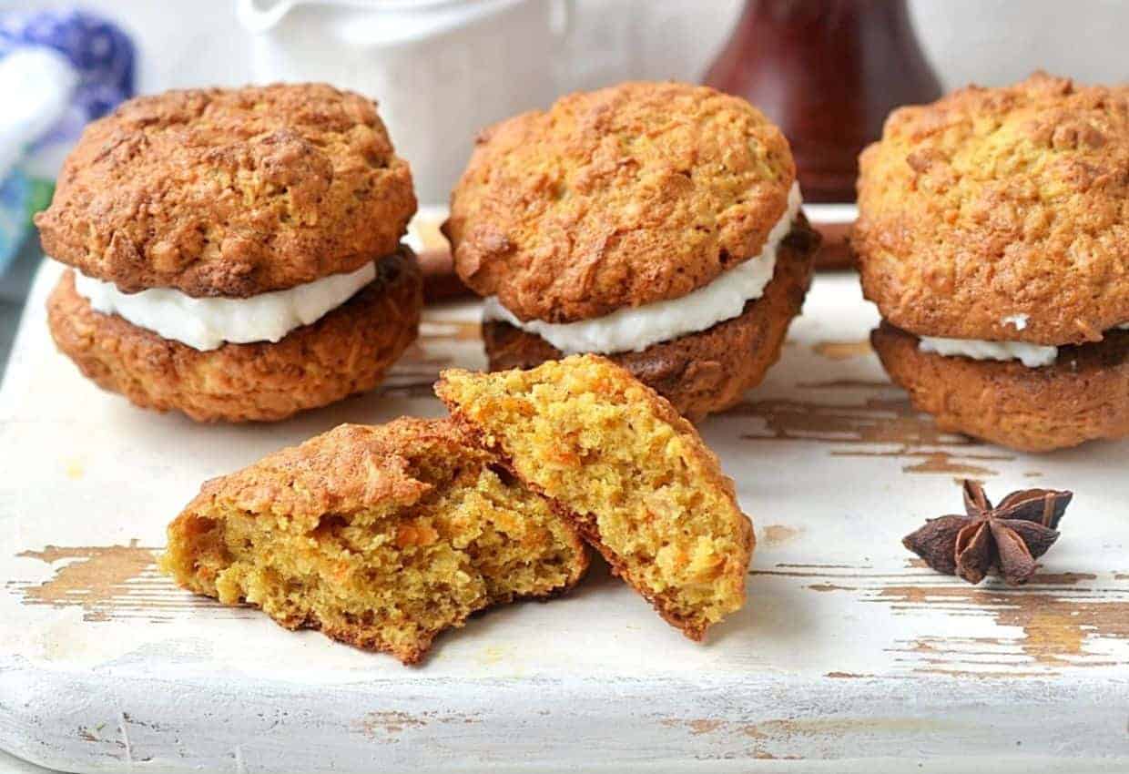 Carrot cake sandwich cookies on plate.