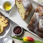 Sweet Low Carb Challah Bread on a white plate with tulips.