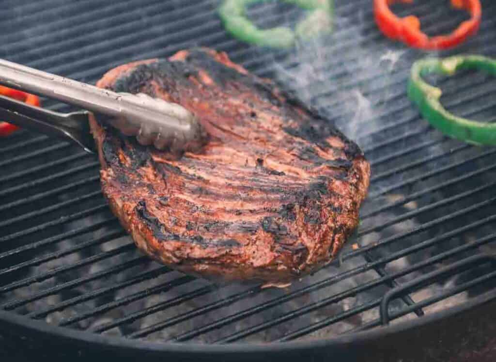 Flank steak on grill.
