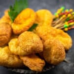 Cheese Puffs in a bowl with fresh parsley.