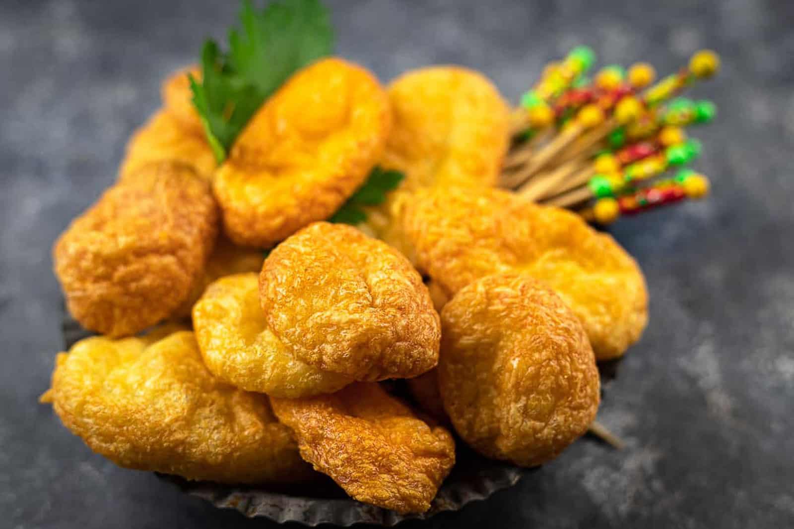 Air fryer cheese puffs with cocktail toothpicks.