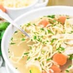 Chicken Noodle Soup with Homemade Keto Egg Noodles in a white bowl.