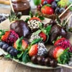 Chocolate Covered Strawberries and berries on a plate.