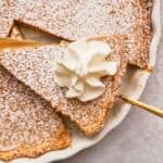 A slice of cinnamon pie on a cake slice over the remaining pie.