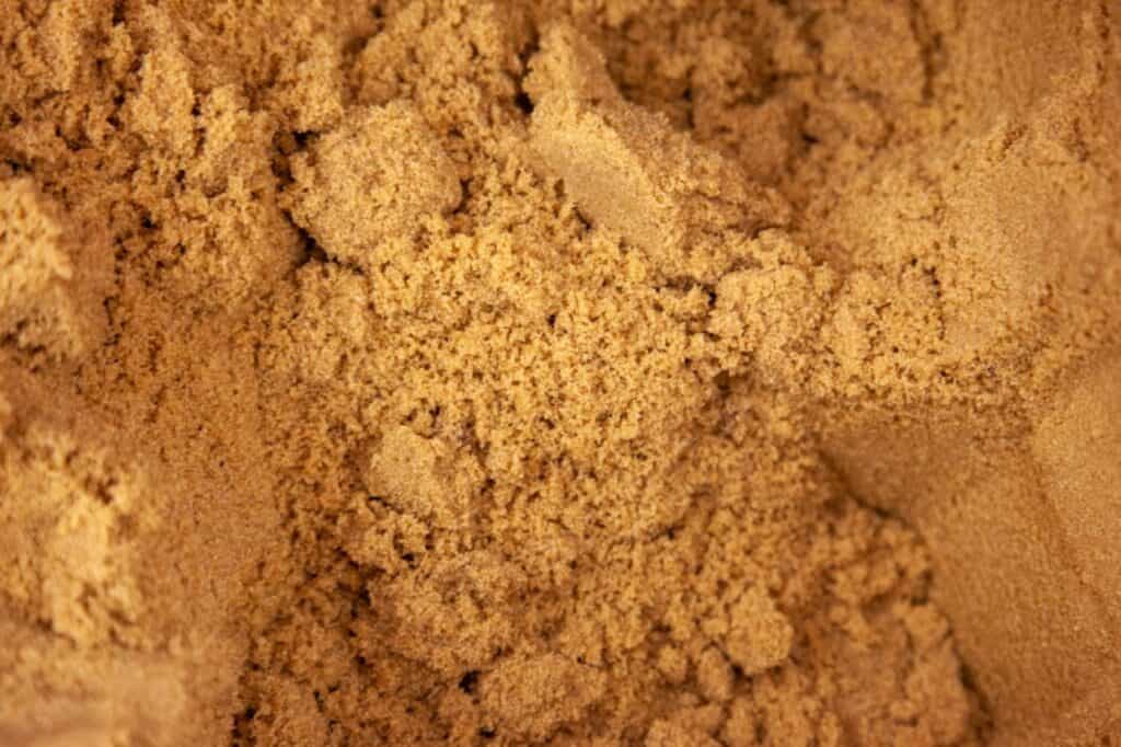 Image shows an overhead closeup shot of brown sugar.