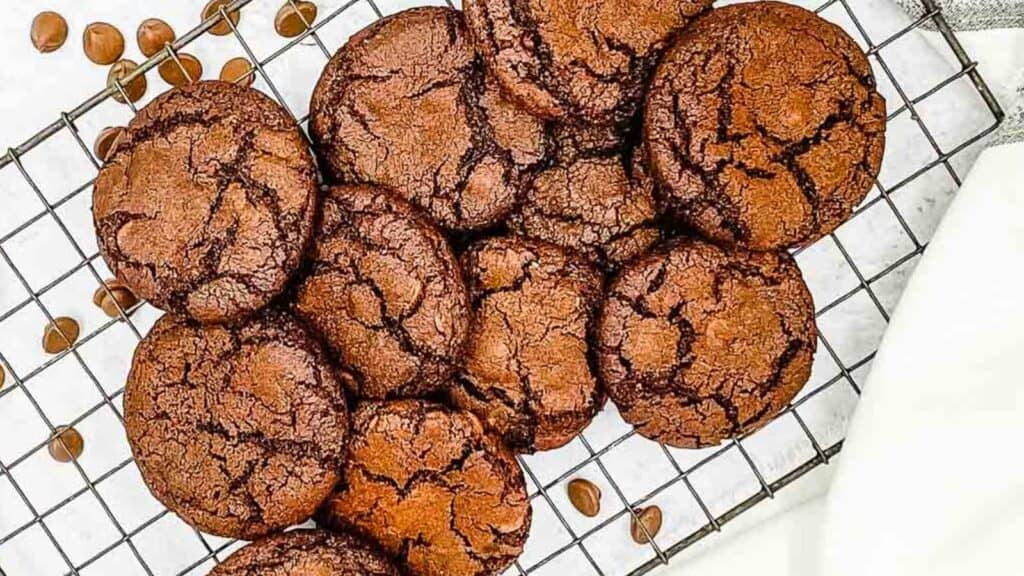 Freshly air fried double chocolate chip cookies on a cooling rack.