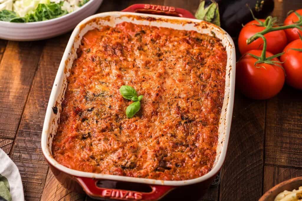Eggplant parmigiana served in a casserole dish.