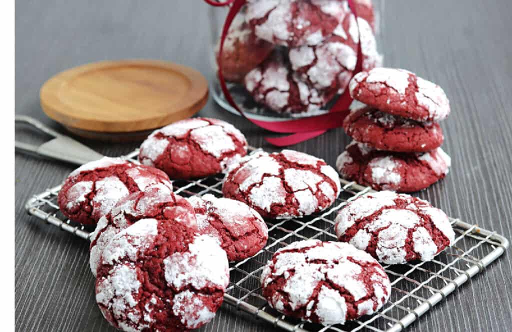 A cooling rack with red velvet crinkle cookies.