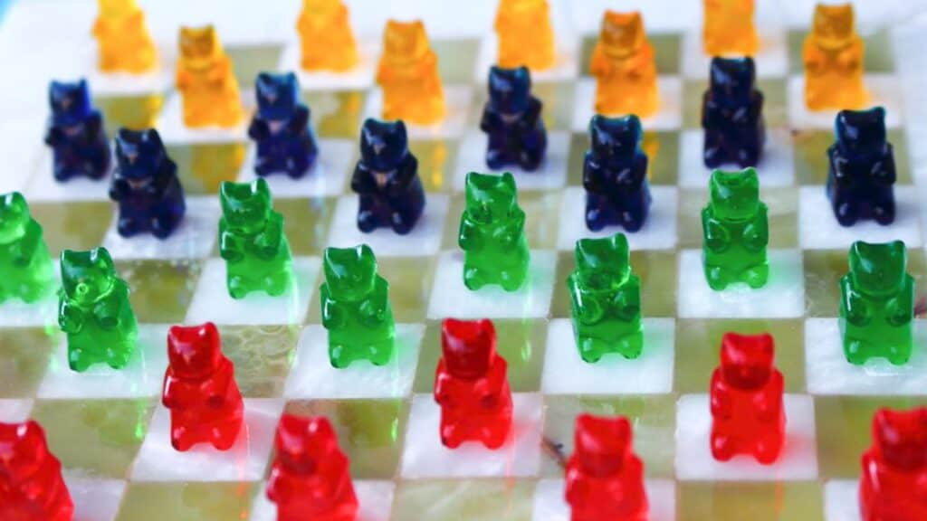 Gummy Bears on a checkered board. 