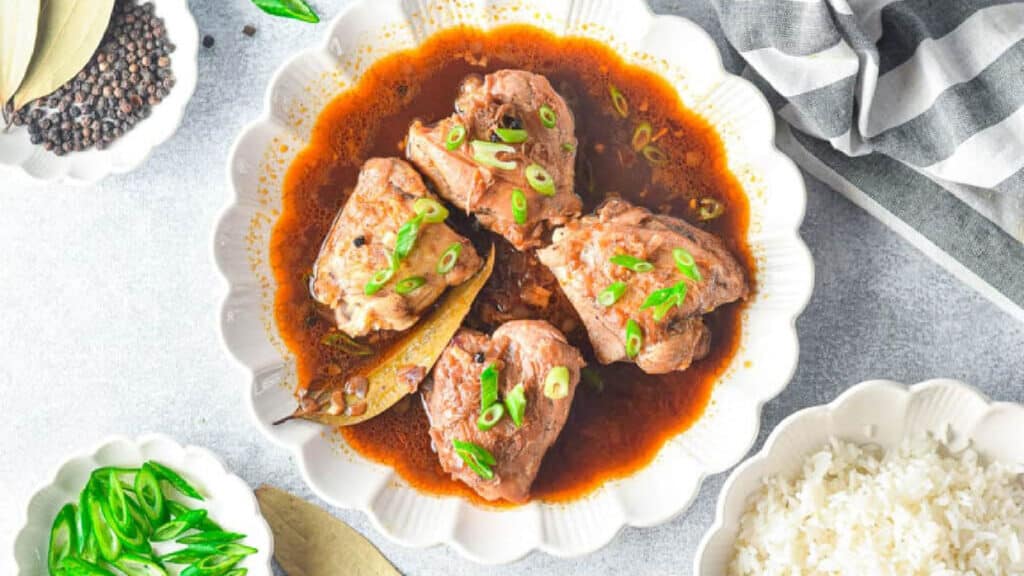 chicken adobo in a white bowl.