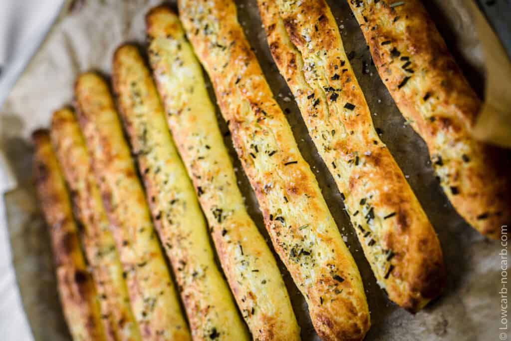 Italian breadsticks on a baking tray.