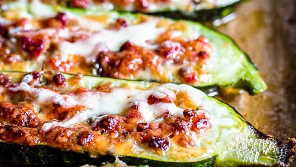 Zucchini Boats on a cutting board.