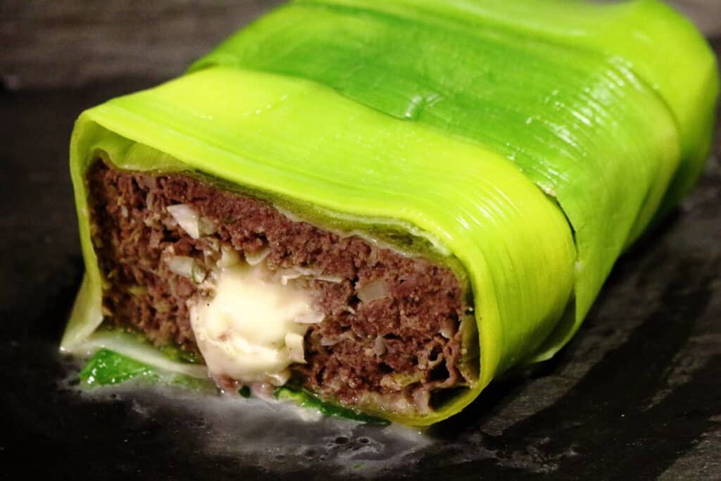 Low Carb Meatloaf with Cheese and Leeks cut open with melted cheese