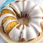 An overhead view of an iced Mountain Dew bundt cake on a yellow plate.