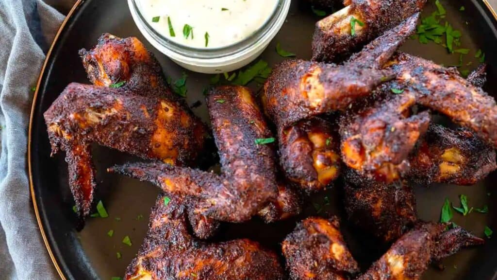 smoked chicken wings by dipping sauce.
