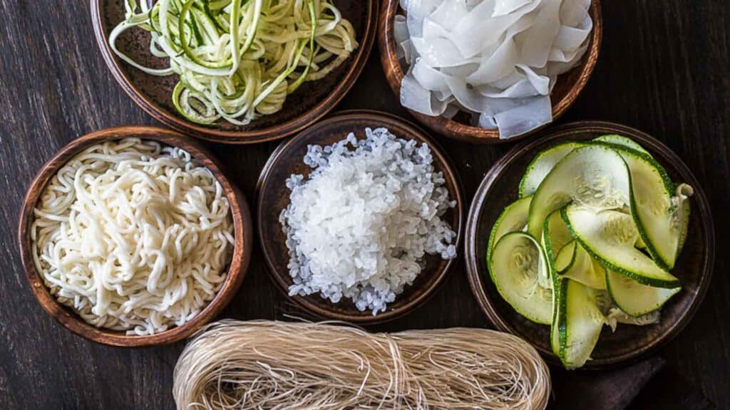 Different Low Carb Pasta Alternatives inside wooden bowls. 