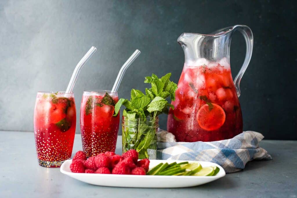 Raspberry mojito cocktails with a mojito party pitcher.
