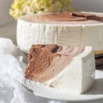 Yogurt Chocolate Ripple Keto Cheesecake piece on a white plate.