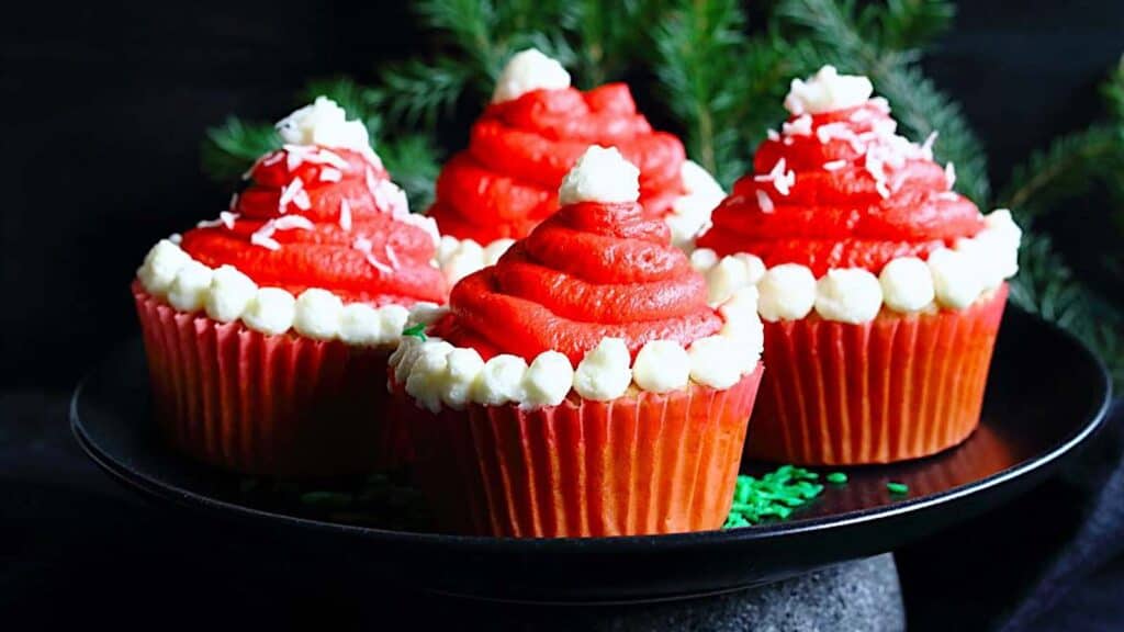 Santa Hats Cupcakes on a plate. 