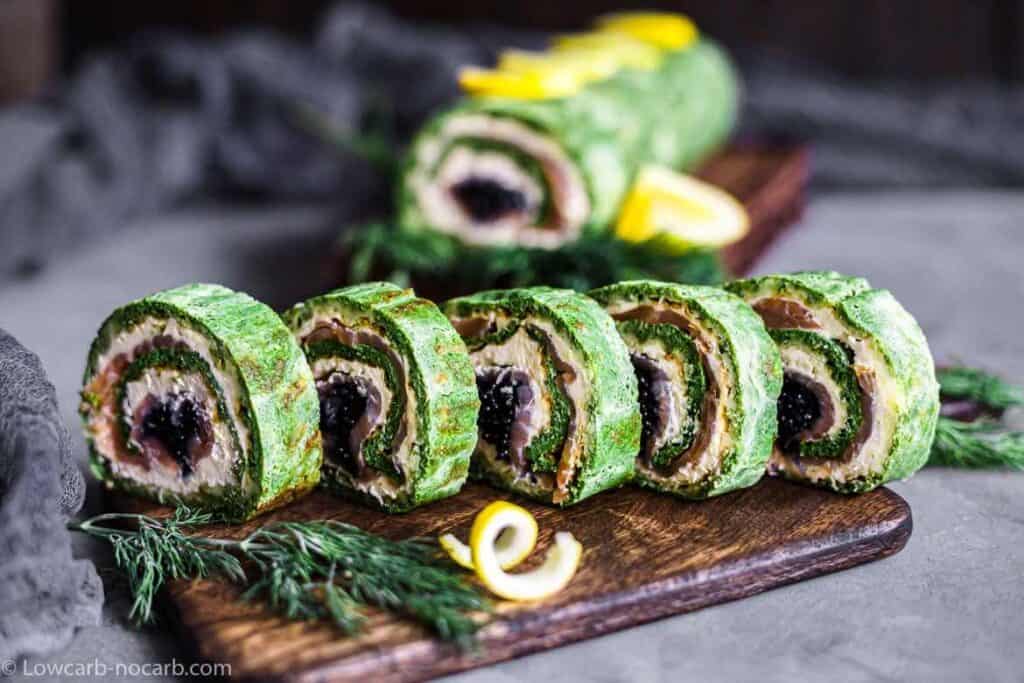 Spinach Salmon Rolls on a wooden board.