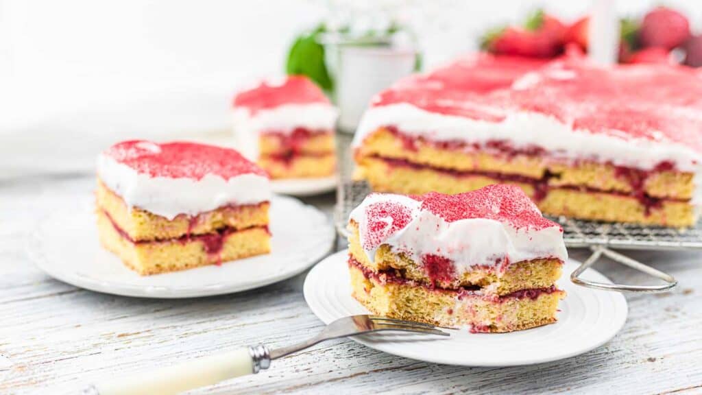Strawberry Sugar Free Cake pieces on a white plates.