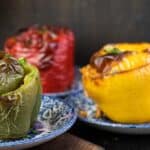 Stuffed bell peppers on a blue plates.