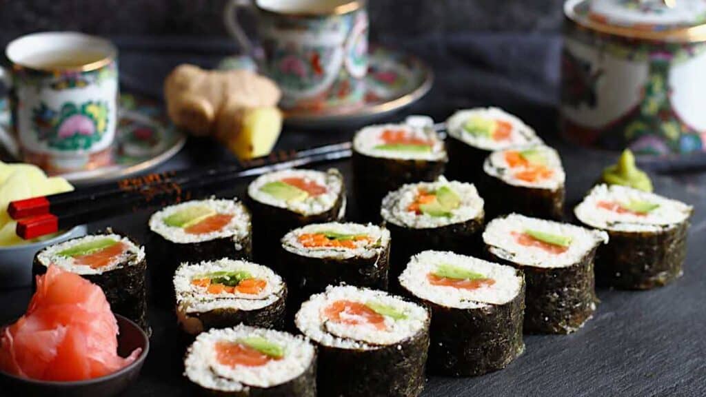 Low Carb Friendly Sushi Rolls served on a black board.