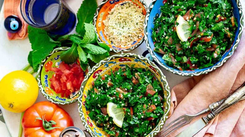 Tabbouleh Salad inside colorful bowls.