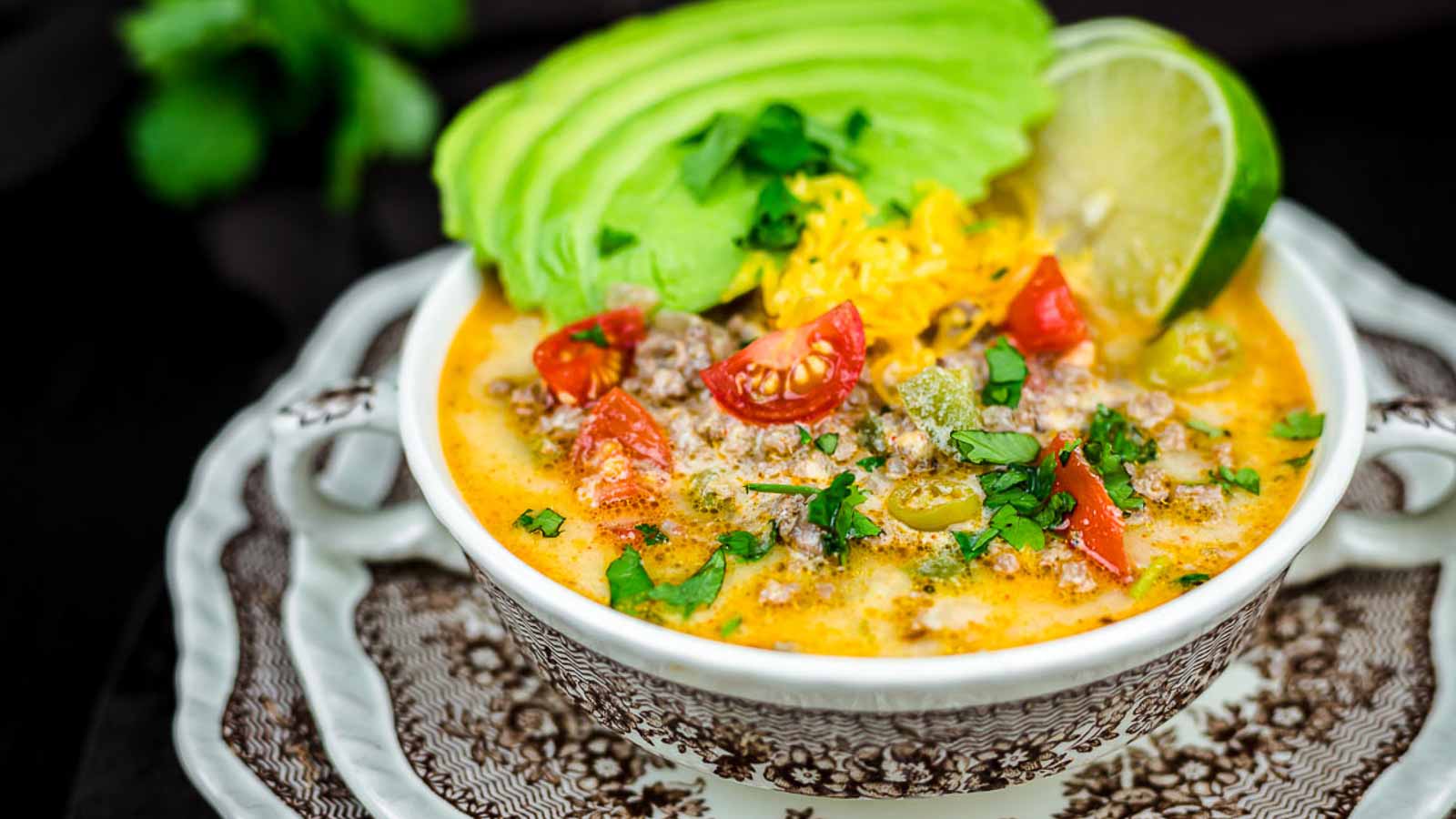 Creamy Taco Soup with gresh avocado slices and lime. 