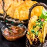 Tacos in a brown basket.