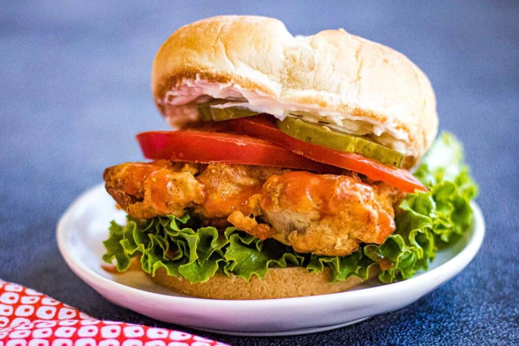 Low angle shot of a fried chicken sandwich.