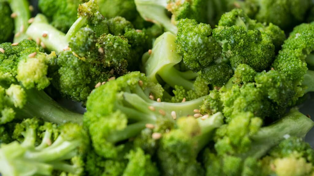 closeup of air fryer broccoli topped with sesame seeds.