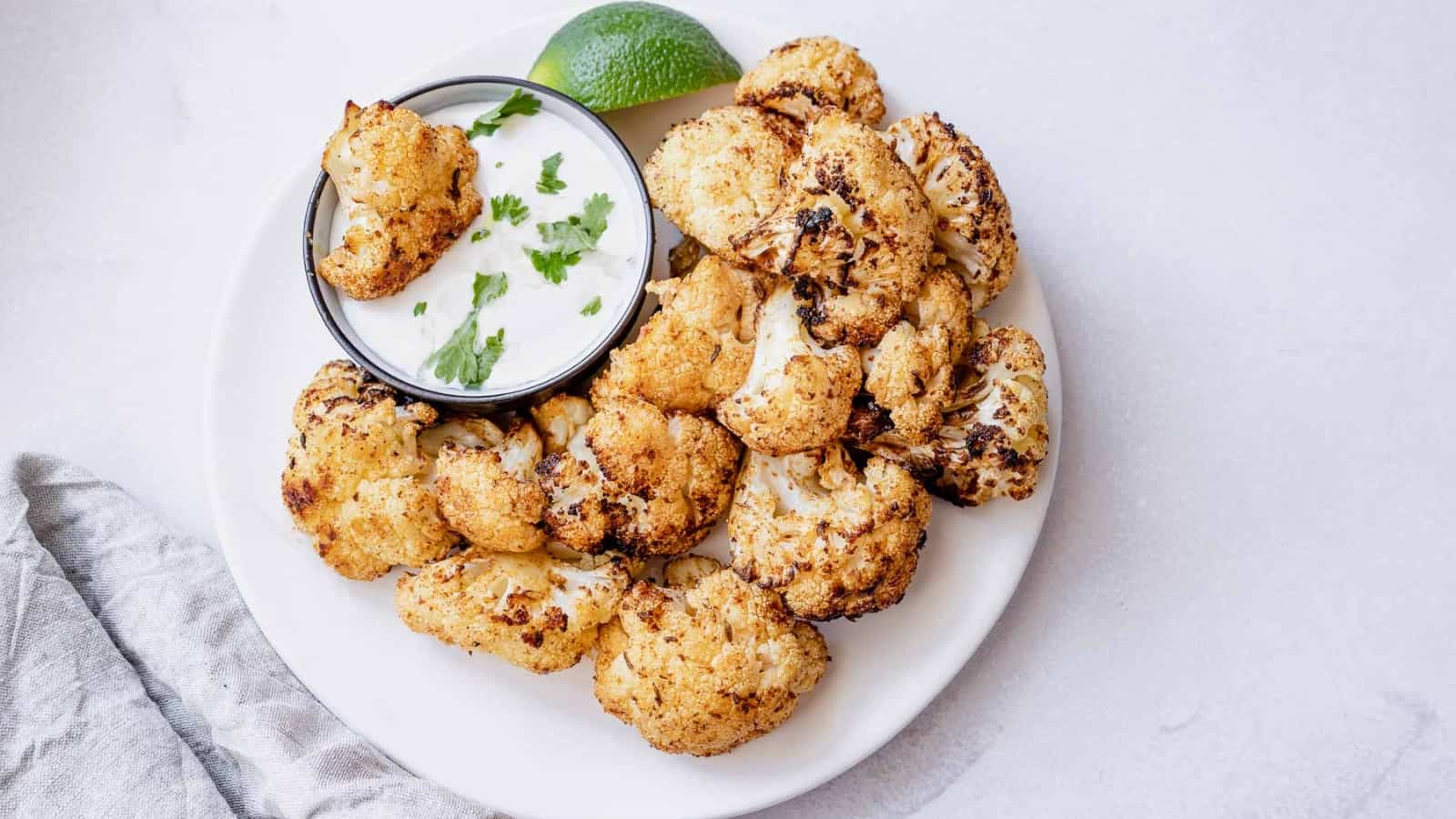 https://fooddrinklife.com/wp-content/uploads/2023/04/air-fryer-cauliflower.jpg