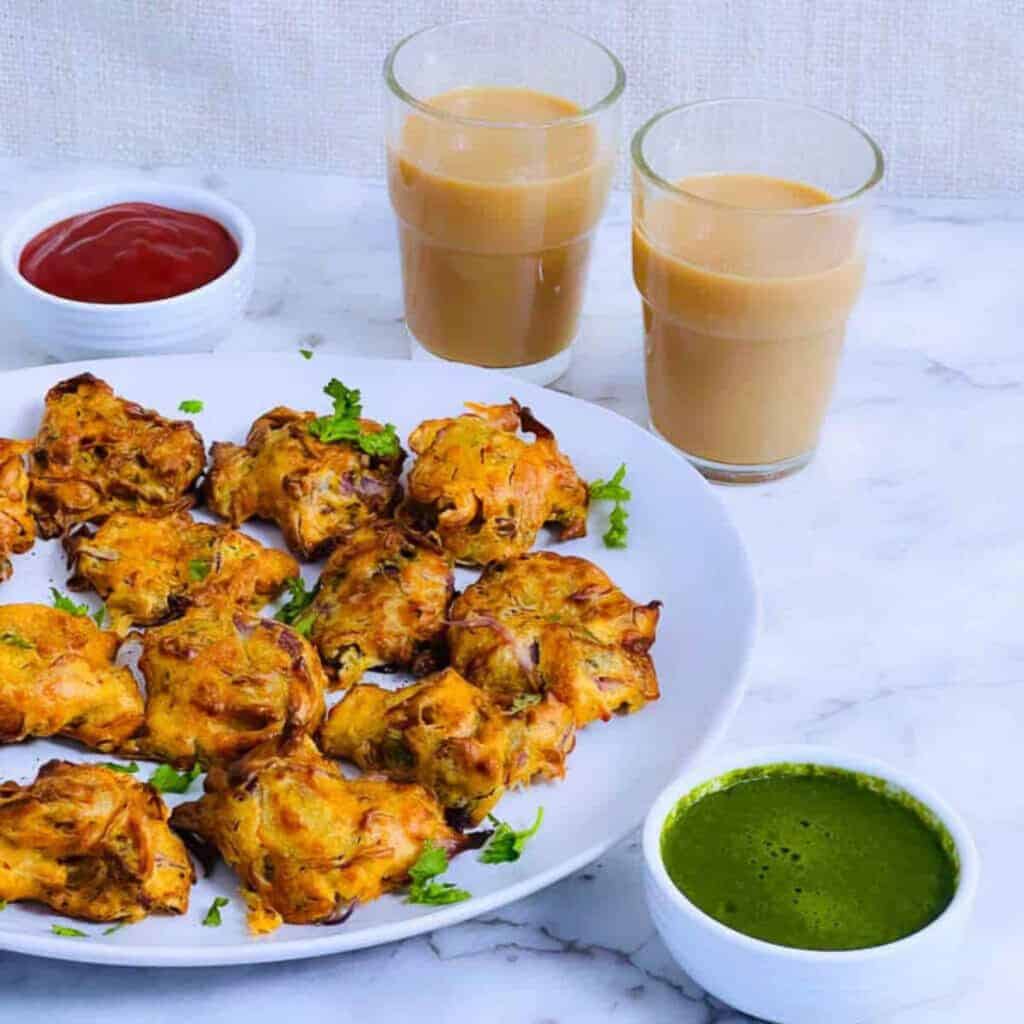 Air fryer onion pakora on a white plate.