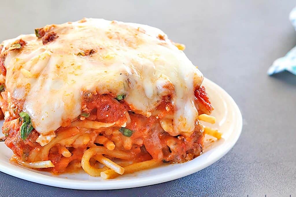 Baked Spaghetti on a white plate.