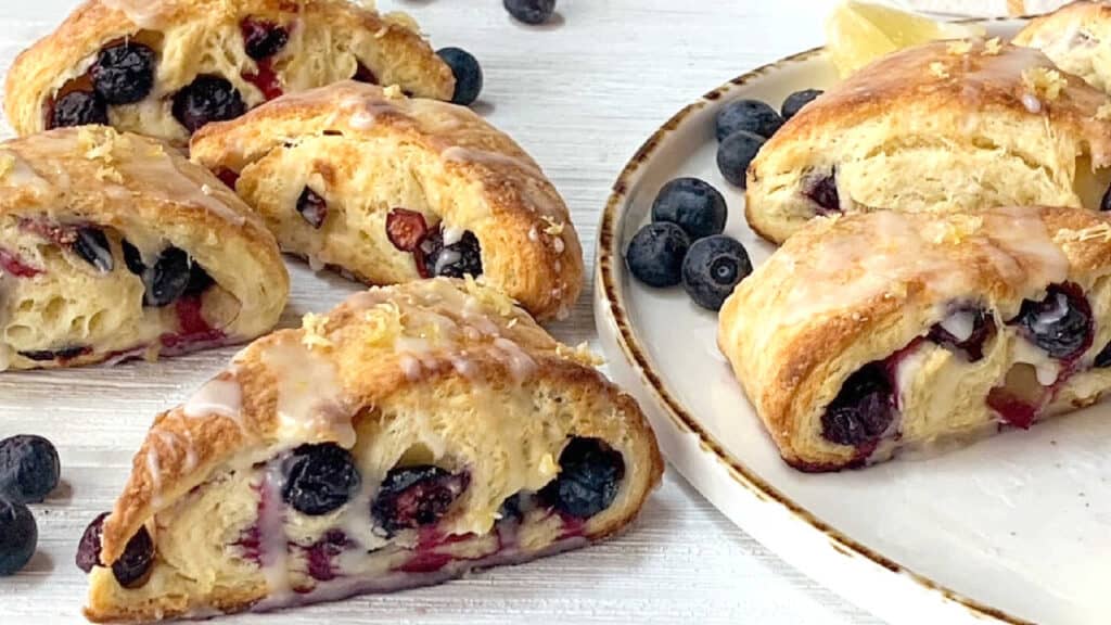 Blueberry scones on a white platter.